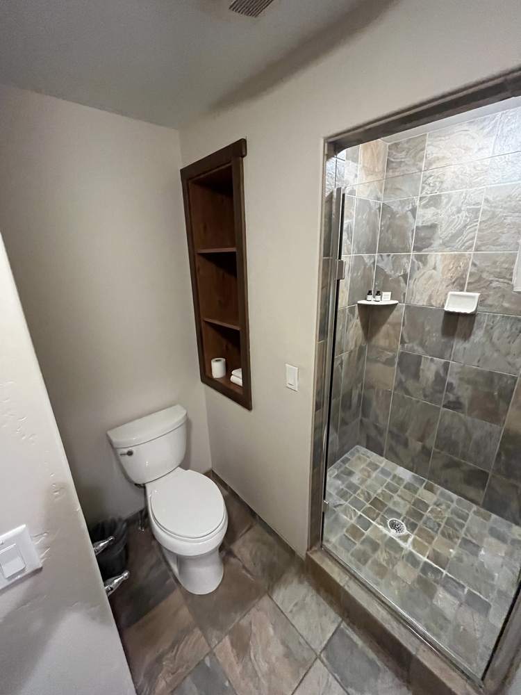 Suite bathroom with slate-tiled stand-up shower